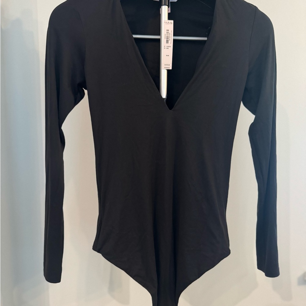 Victoria’s Secret long-sleeve deep-V bodysuit/onesie – Size M (medium)